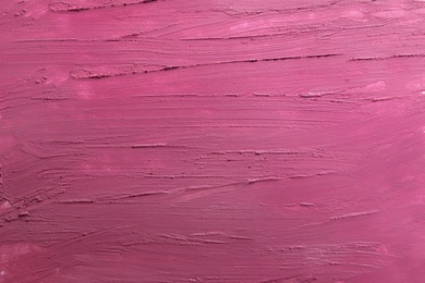 Photo of Strokes of lipstick as background, top view