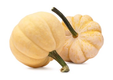 Photo of Two fresh yellow pumpkins isolated on white