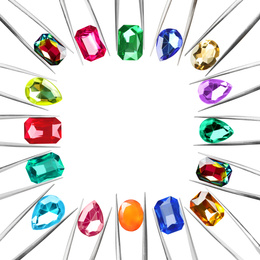Image of Frame of tweezers with different shiny gemstones on white background