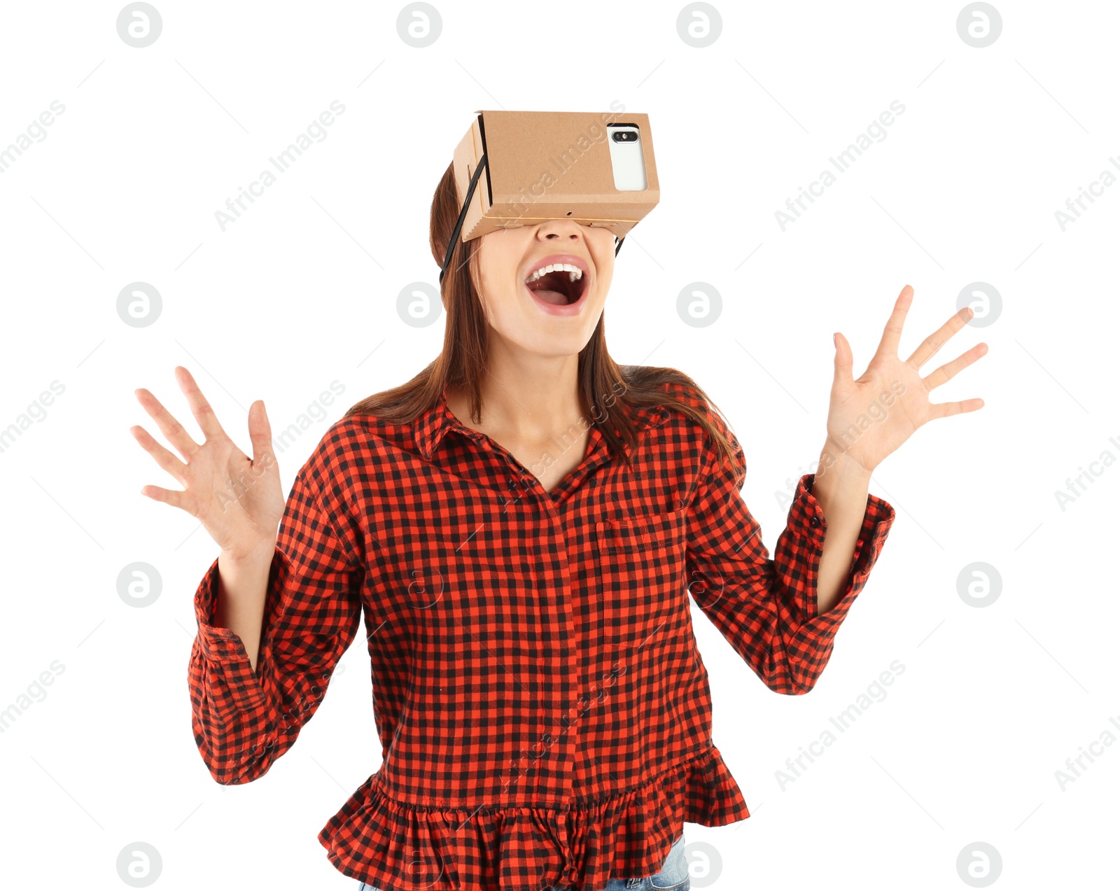 Photo of Young woman using cardboard virtual reality headset, isolated on white