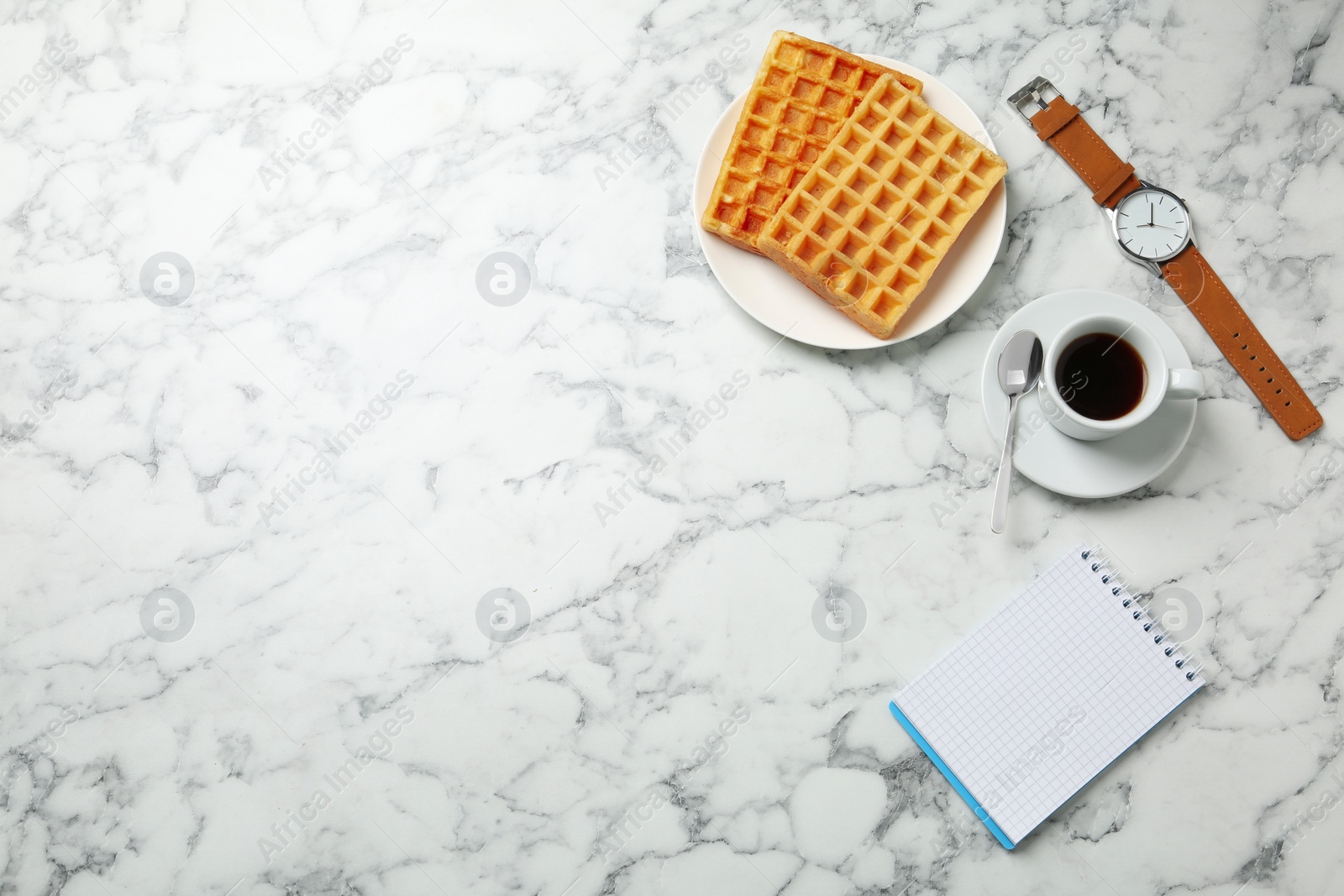 Photo of Breakfast with wafers and coffee on marble table, flat lay. Space for text