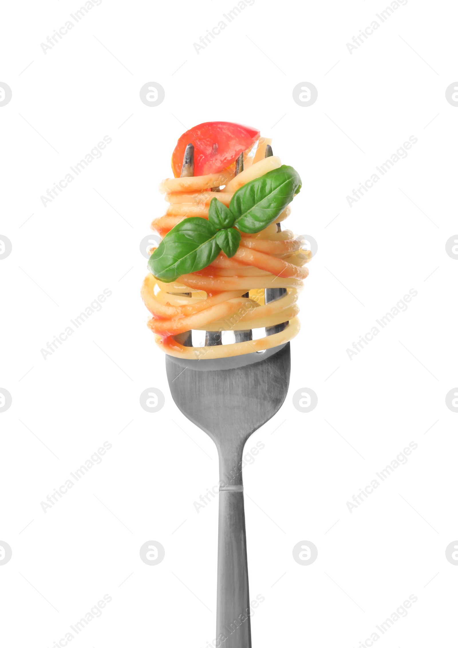 Photo of Fork with tasty pasta, tomato sauce and basil isolated on white