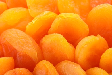 Tasty apricots as background, closeup. Dried fruit as healthy food