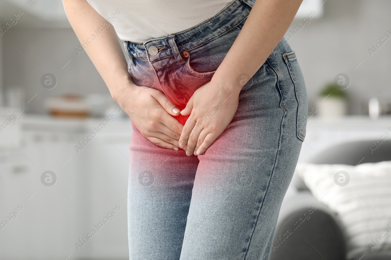 Image of Woman suffering from cystitis symptoms indoors, closeup