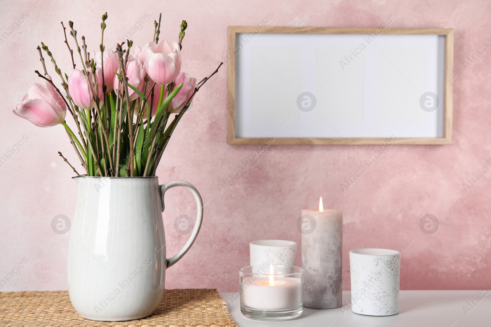 Photo of Beautiful bouquet with spring pink tulips on table