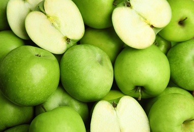 Fresh ripe green apples as background, closeup view