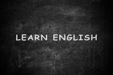 Image of Black chalkboard with text Learn English 