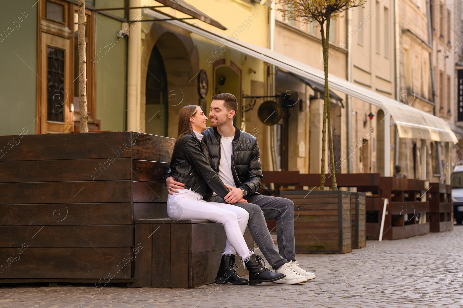 Photo of Lovely young couple enjoying time together outdoors. Romantic date