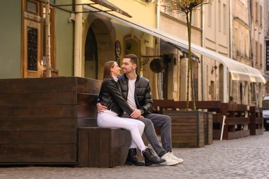 Photo of Lovely young couple enjoying time together outdoors. Romantic date