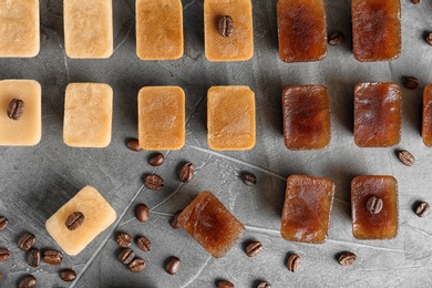 Photo of Flat lay composition with coffee ice cubes on grey background