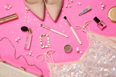 Flat lay composition with women's accessories, stylish shoes and dress on pink background