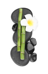 Photo of Spa stones, beautiful flower and bamboo stems on white background, top view