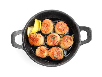 Photo of Delicious fried scallops in pan isolated on white, top view