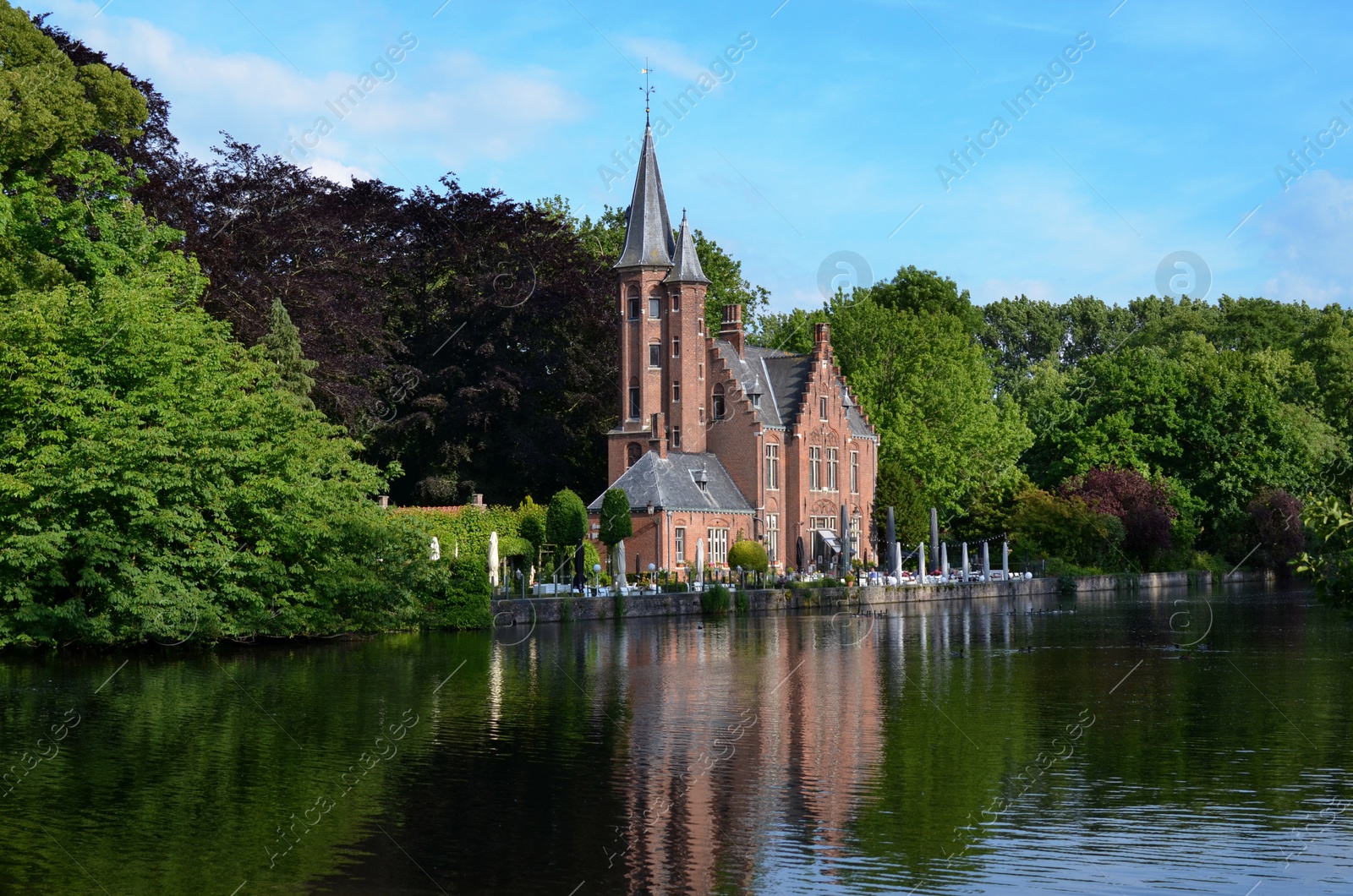 Photo of BRUGES, BELGIUM - JUNE 14, 2019: De la Faille Castle with beautiful garden on Minnewater lake