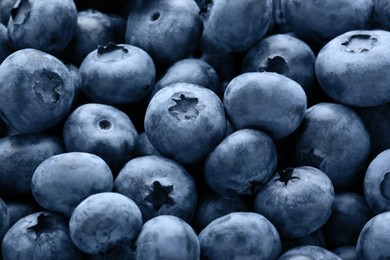Photo of Tasty fresh ripe blueberries as background, closeup