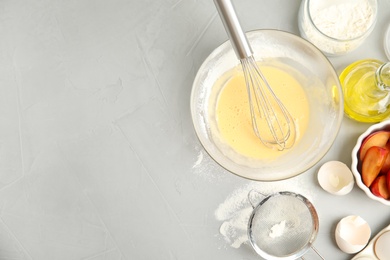 Dough and ingredients for cake on light grey table, flat lay. Space for text