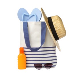 Stylish bag with beach accessories isolated on white