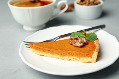 Piece of fresh homemade pumpkin pie on table