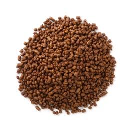 Pile of buckwheat tea granules on white background, top view