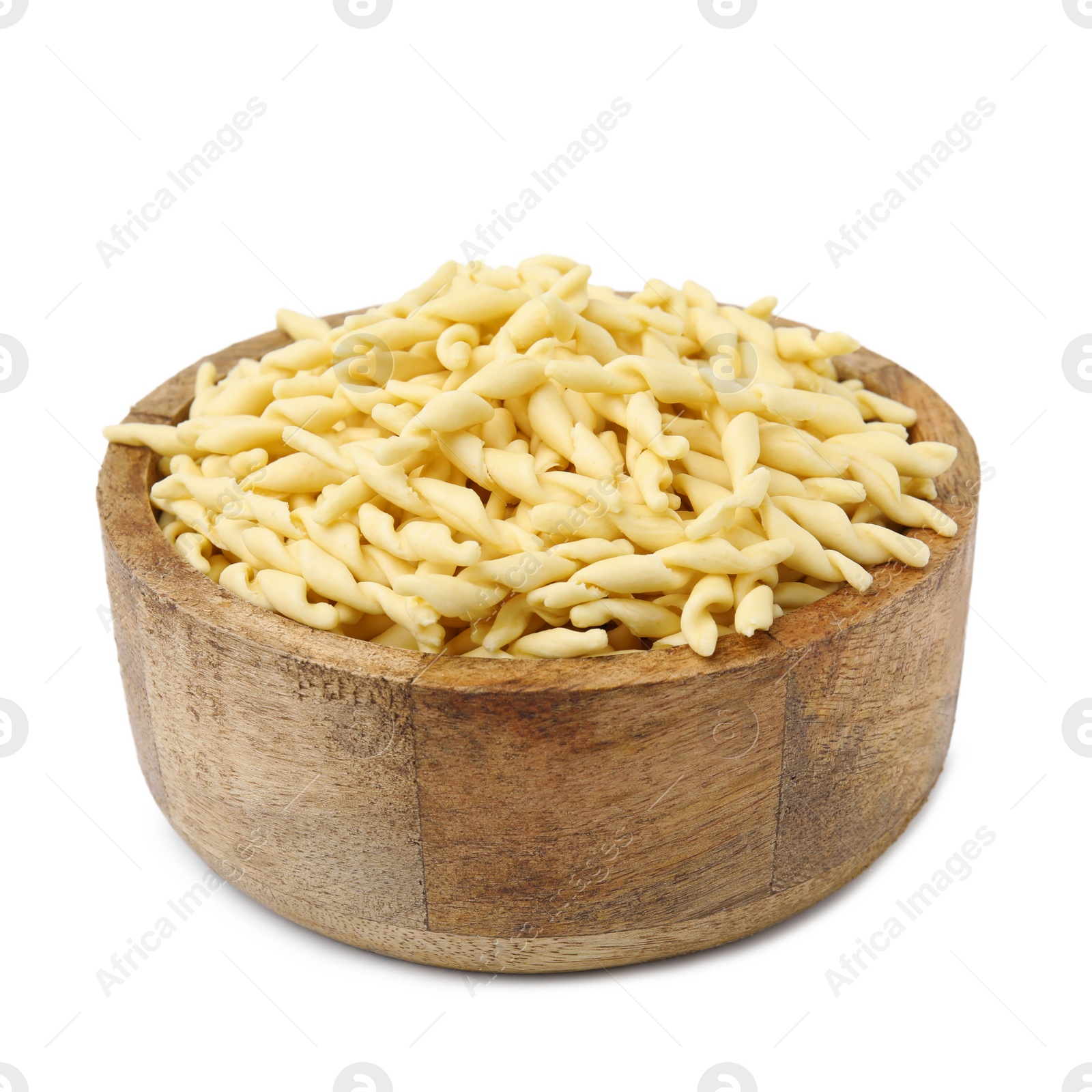 Photo of Uncooked trofie pasta in bowl isolated on white