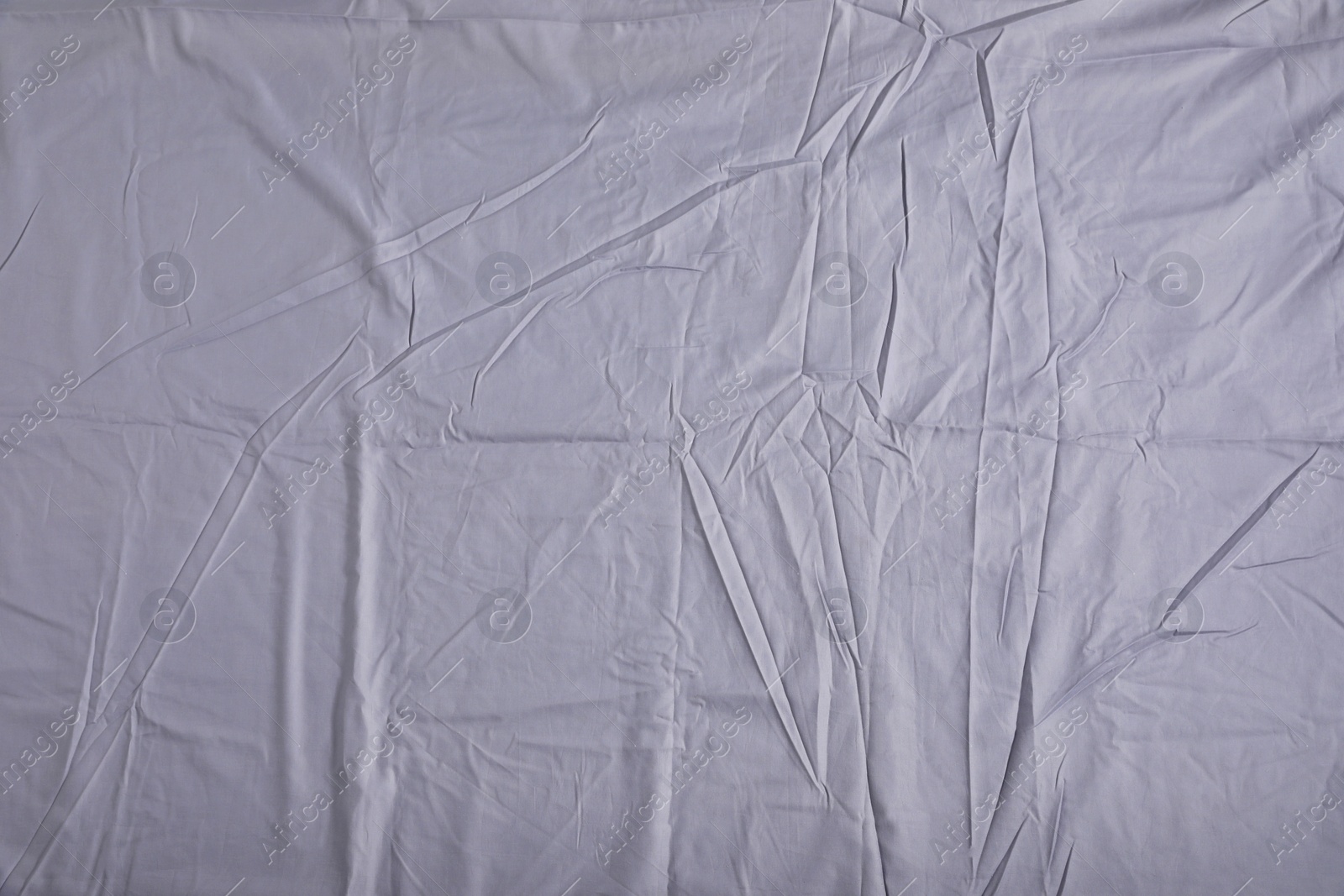 Photo of Crumpled grey fabric as background, top view