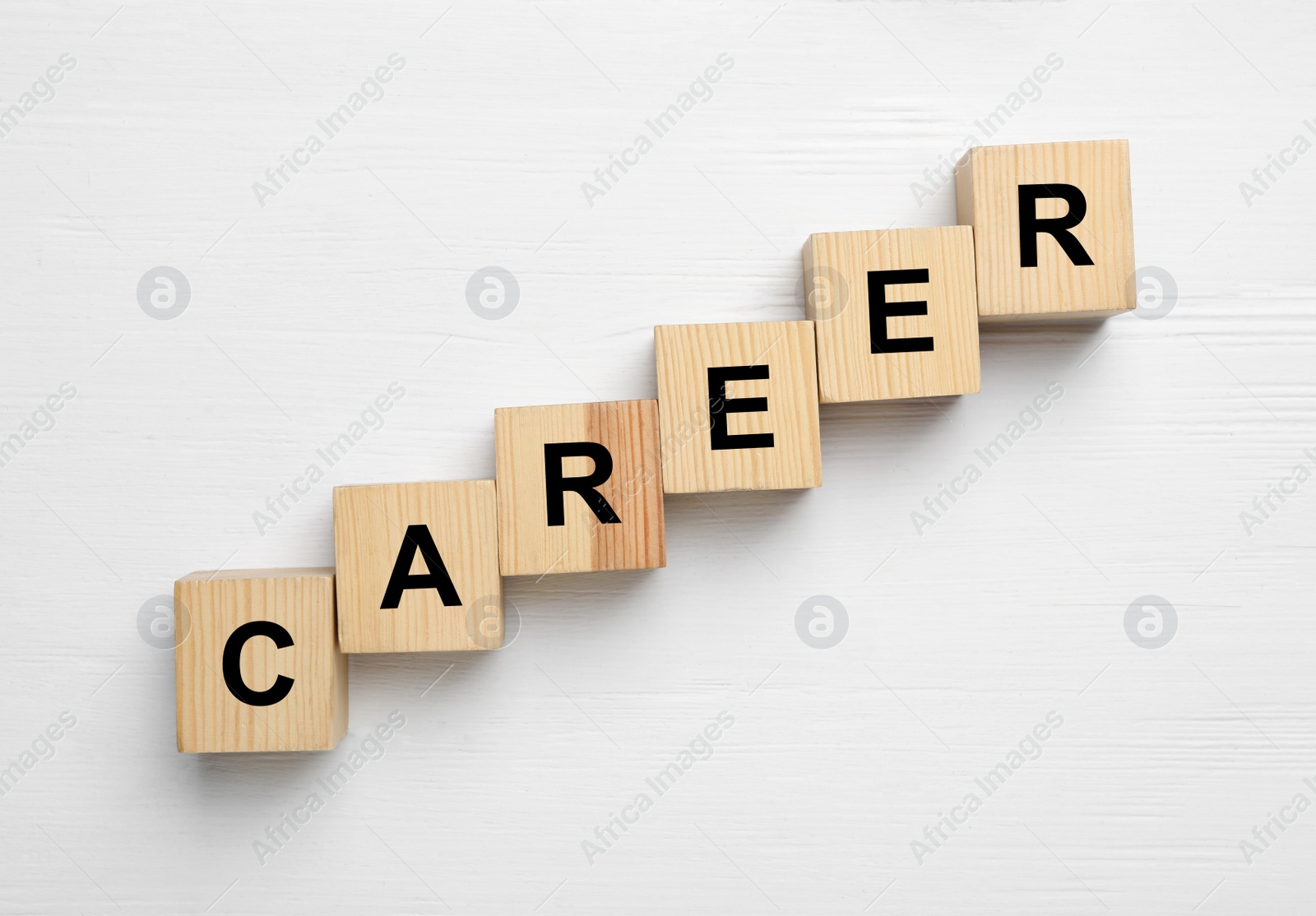 Photo of Cubes with word CAREER on white wooden background, flat lay