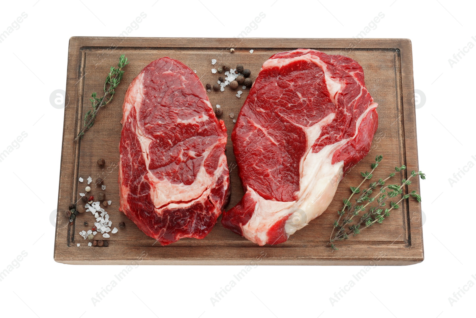 Photo of Pieces of fresh beef meat, thyme and spices on white background, top view