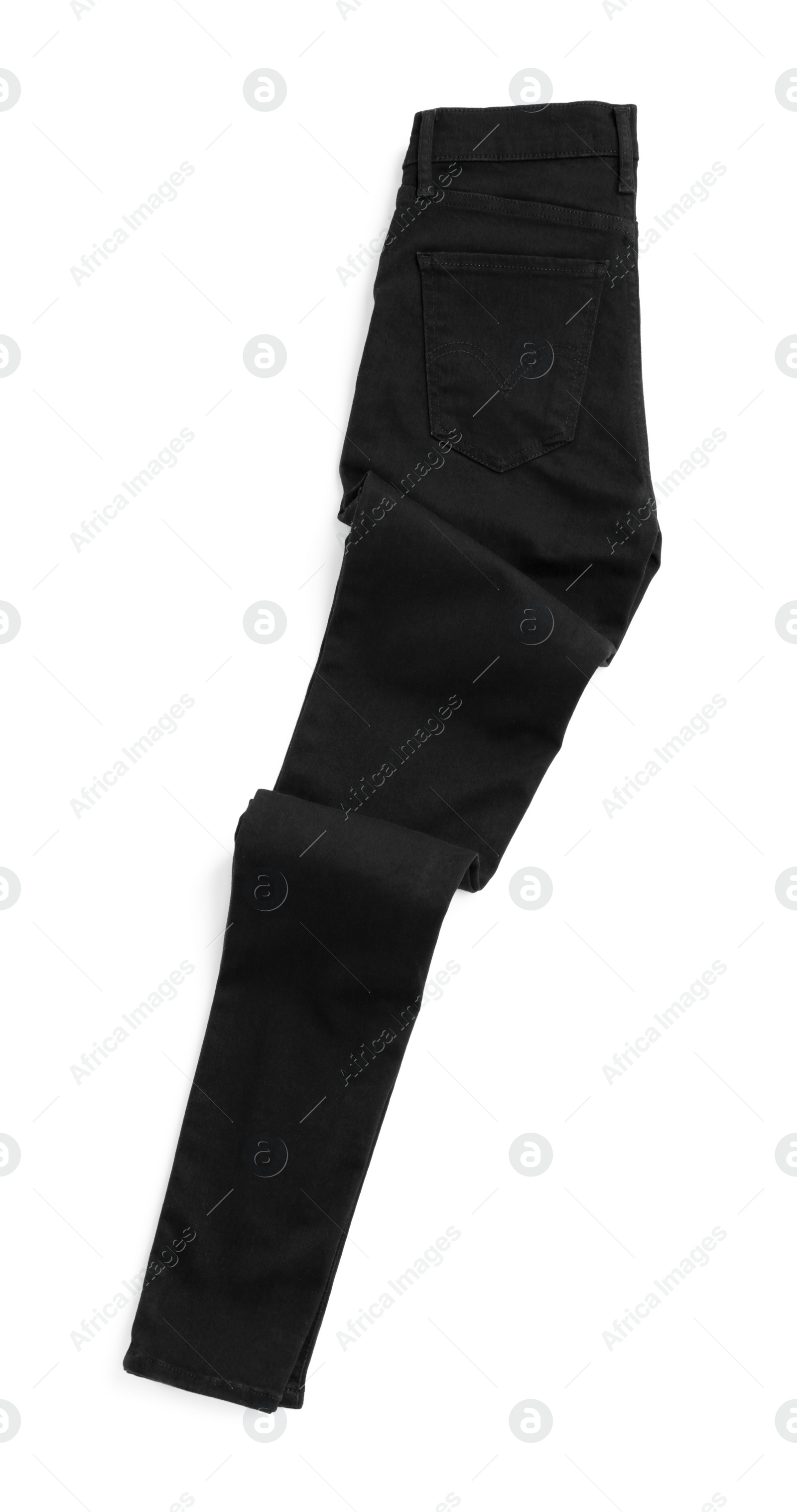 Photo of Stylish black jeans isolated on white, top view