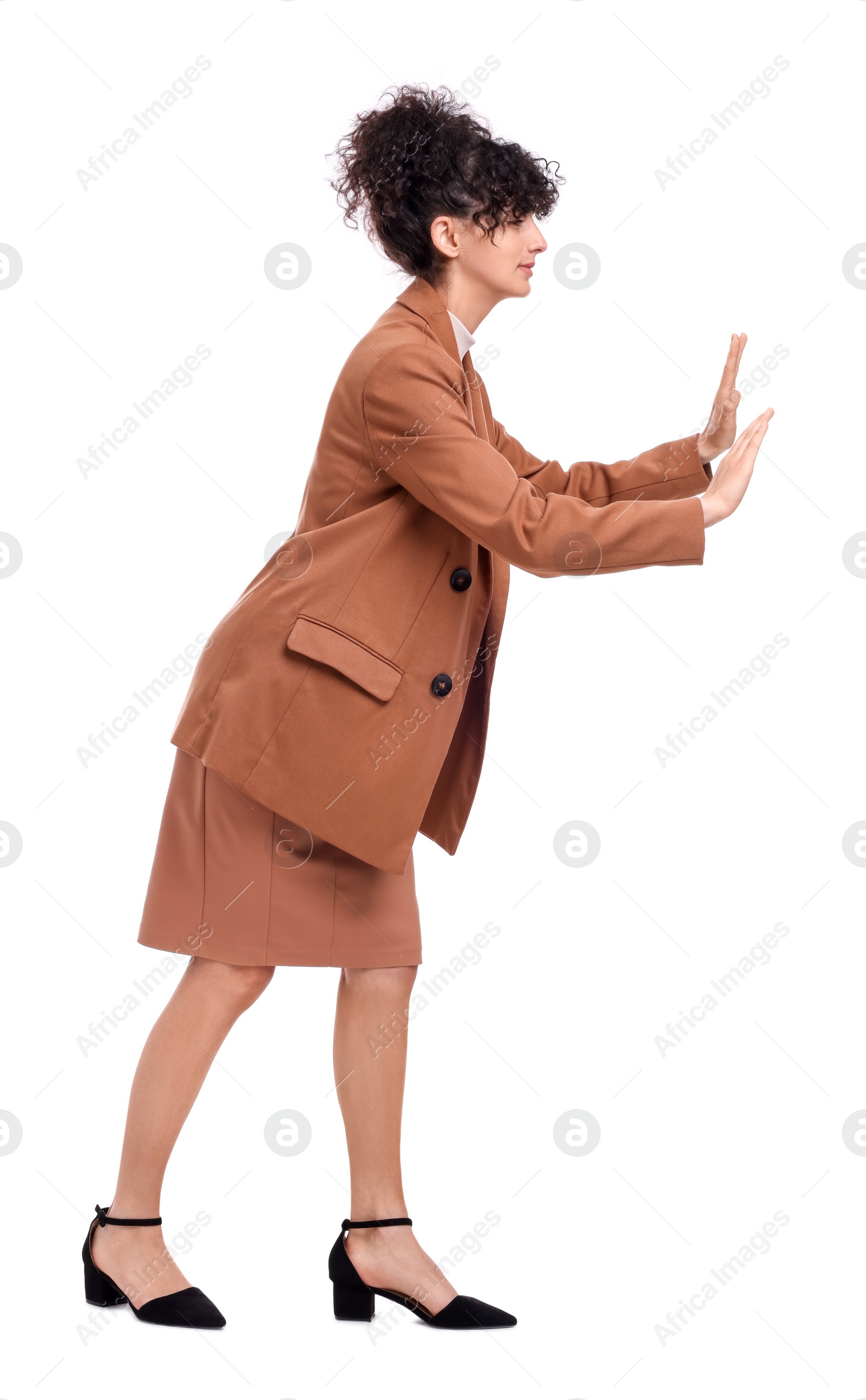 Photo of Beautiful businesswoman in suit avoiding something on white background