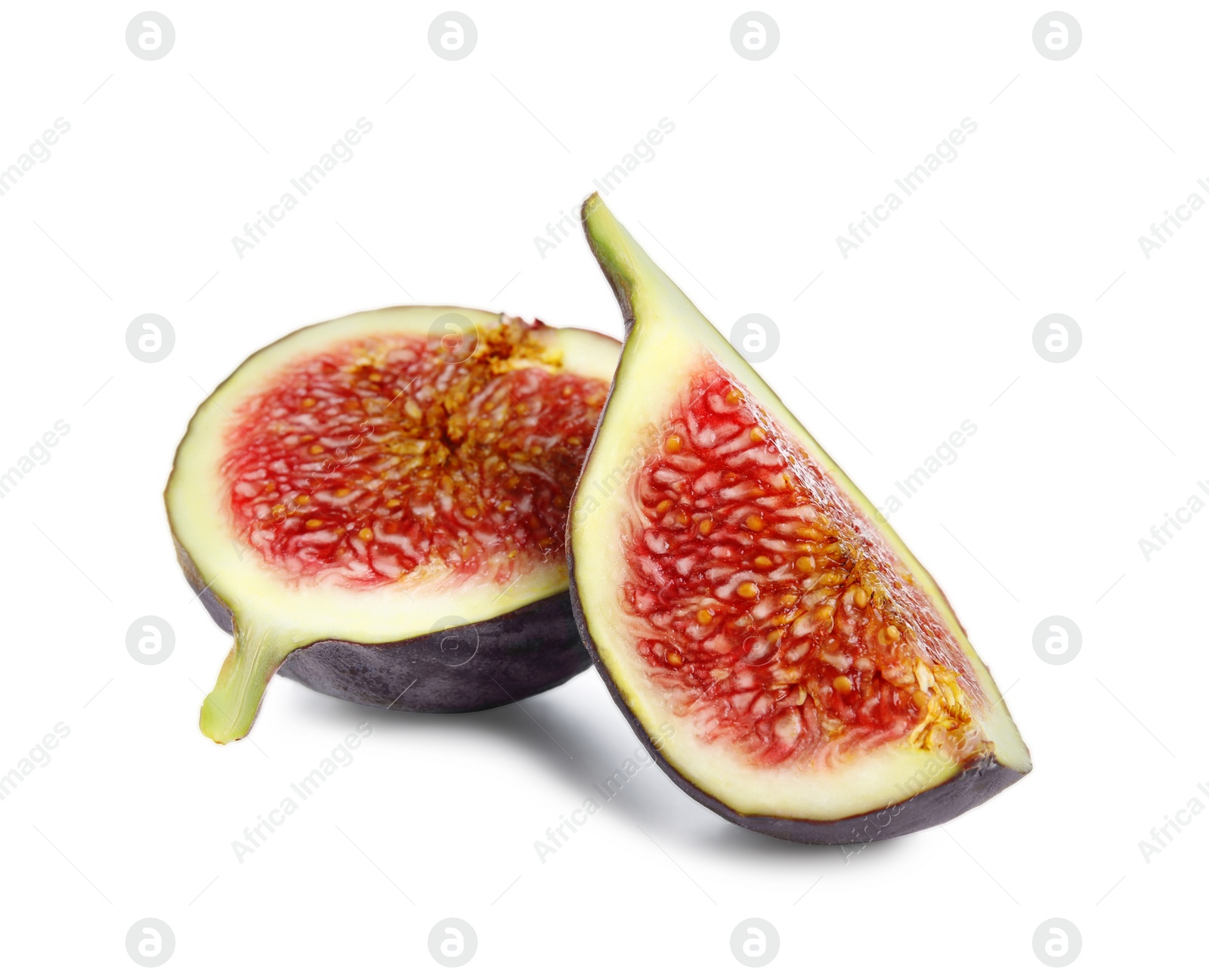 Photo of Pieces of fresh ripe fig isolated on white