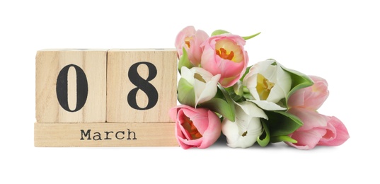 Photo of Wooden block calendar with date 8th of March and tulips on white background. International Women's Day