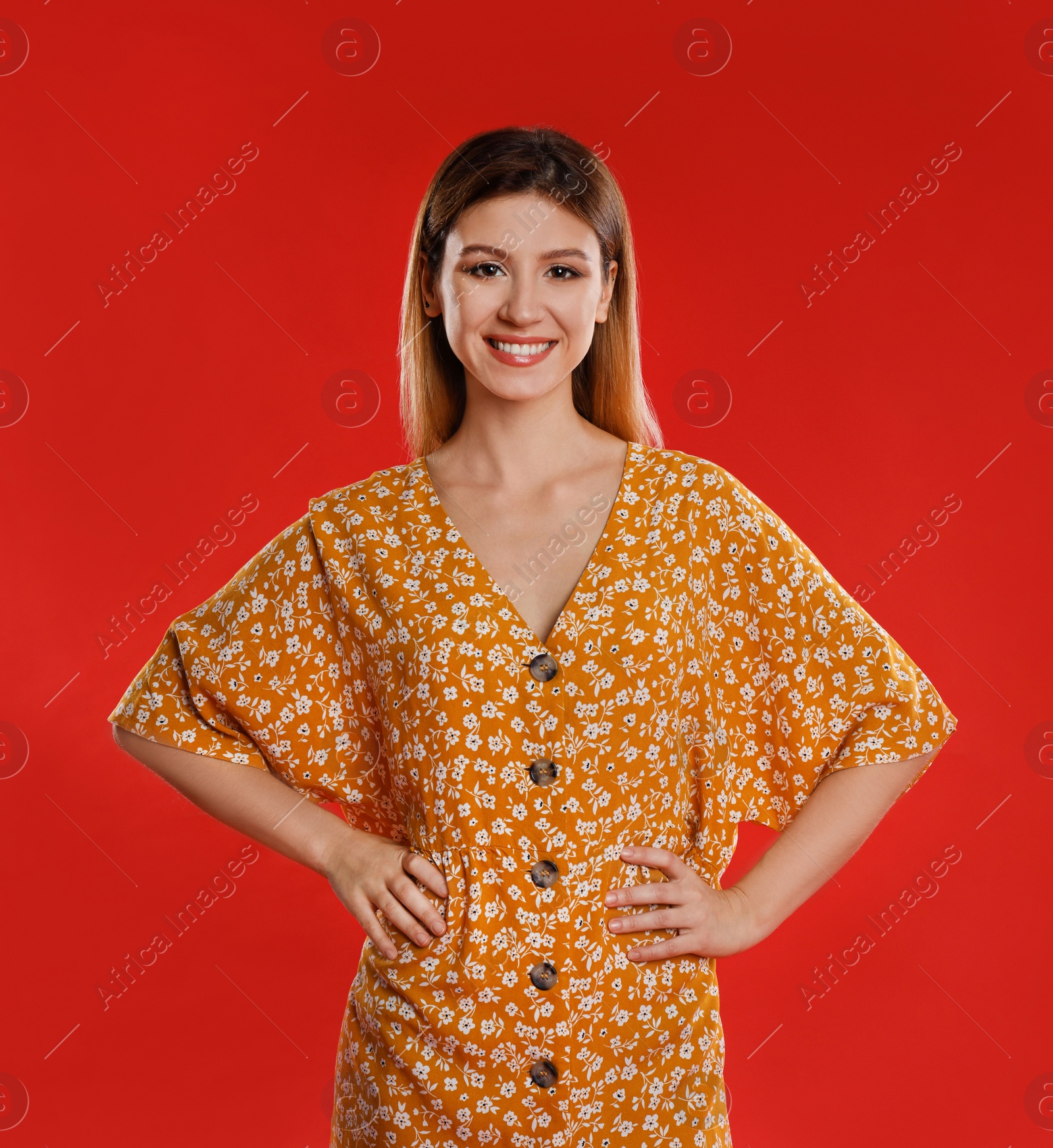 Photo of Portrait of young woman on red background