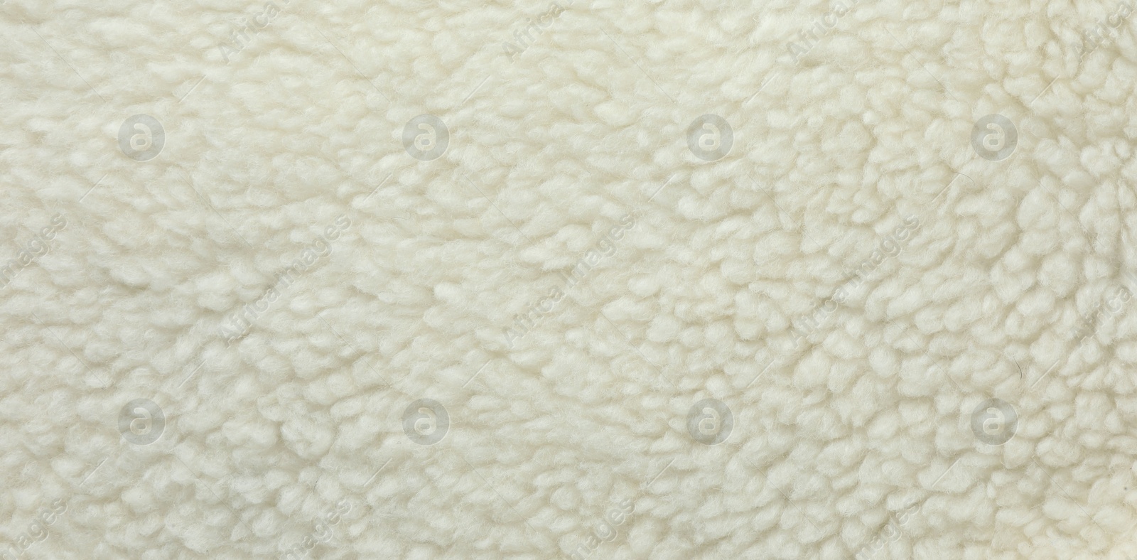 Photo of Texture of white fleece fabric as background, top view