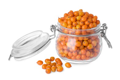 Glass jar with fresh ripe sea buckthorn berries on white background