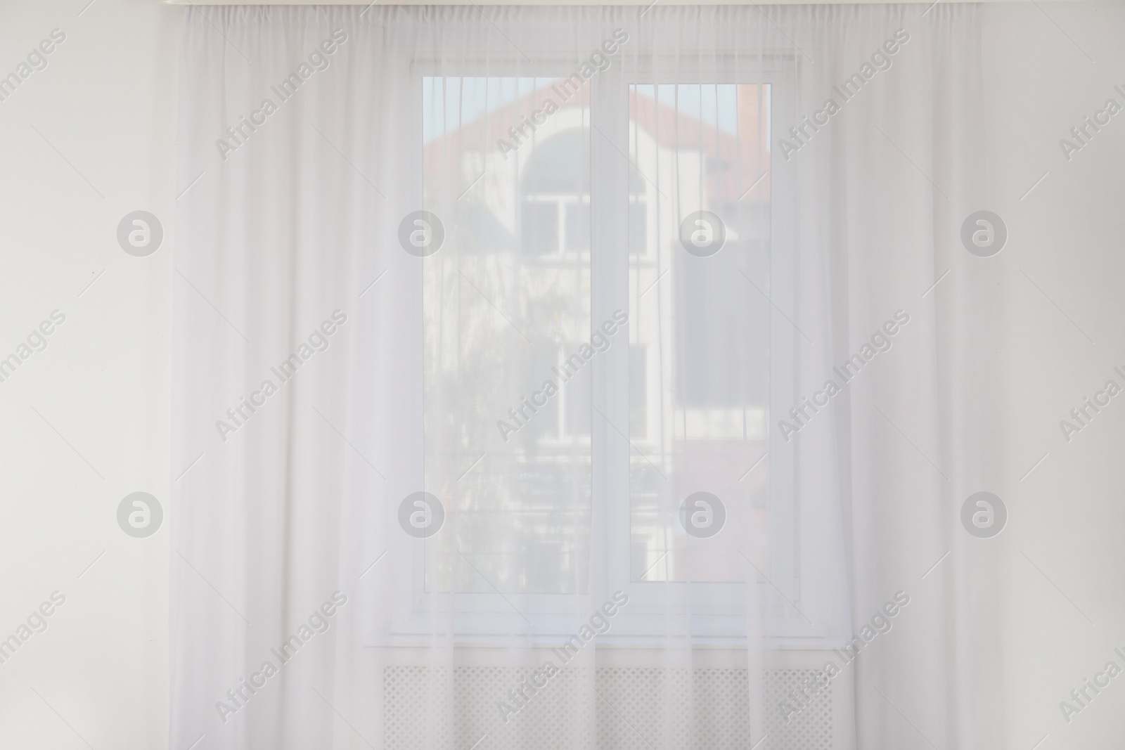 Photo of Light empty room with window and curtain. Home interior