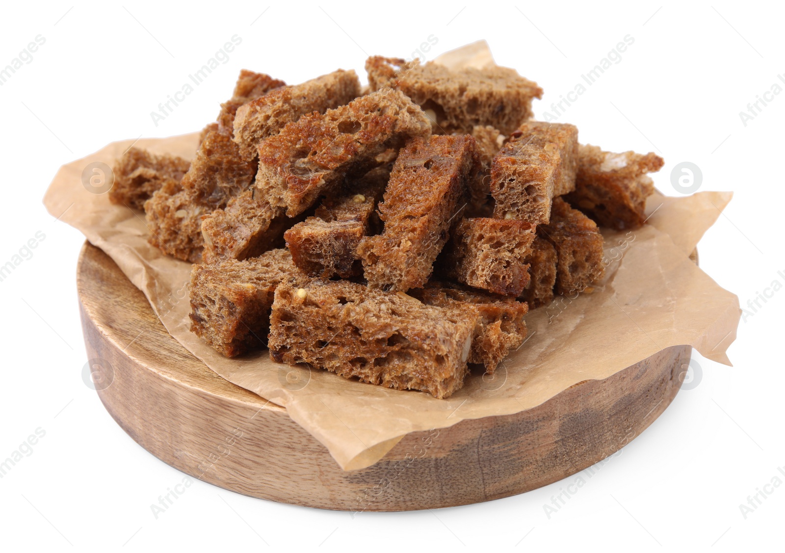 Photo of Wooden tray with crispy rusks isolated on white