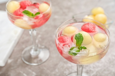 Tasty watermelon and melon ball drink on table, closeup