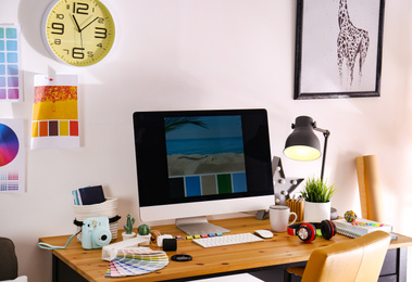 Comfortable designer's workplace with modern computer in studio