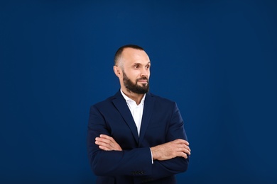 Portrait of handsome man on blue background