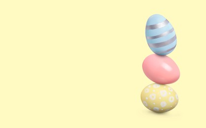 Image of Stack of Easter eggs on beige background, space for text
