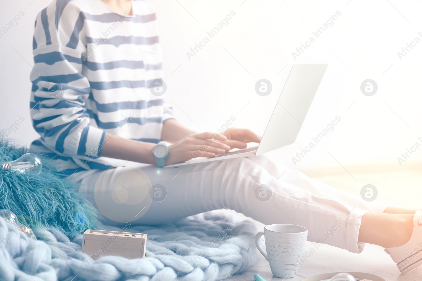 Image of Woman working with laptop at home, closeup