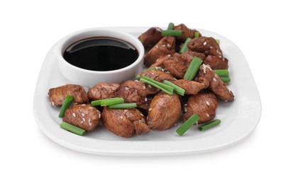 Plate with tasty soy sauce, roasted meat, sesame and green onion isolated on white