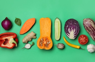 Photo of Flat lay composition with fresh ripe vegetables on color background