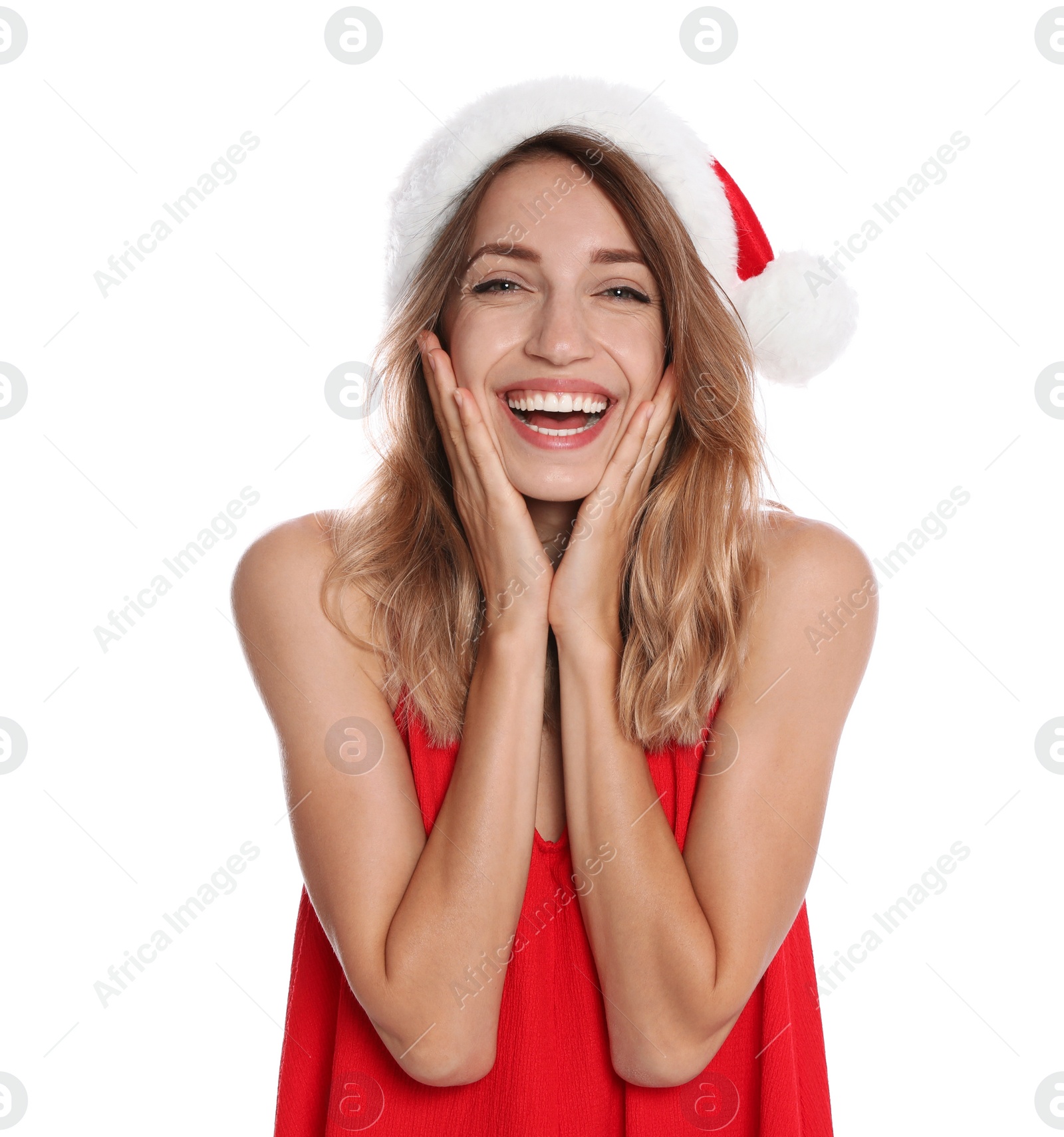 Photo of Happy young woman in Santa hat on white background. Christmas celebration