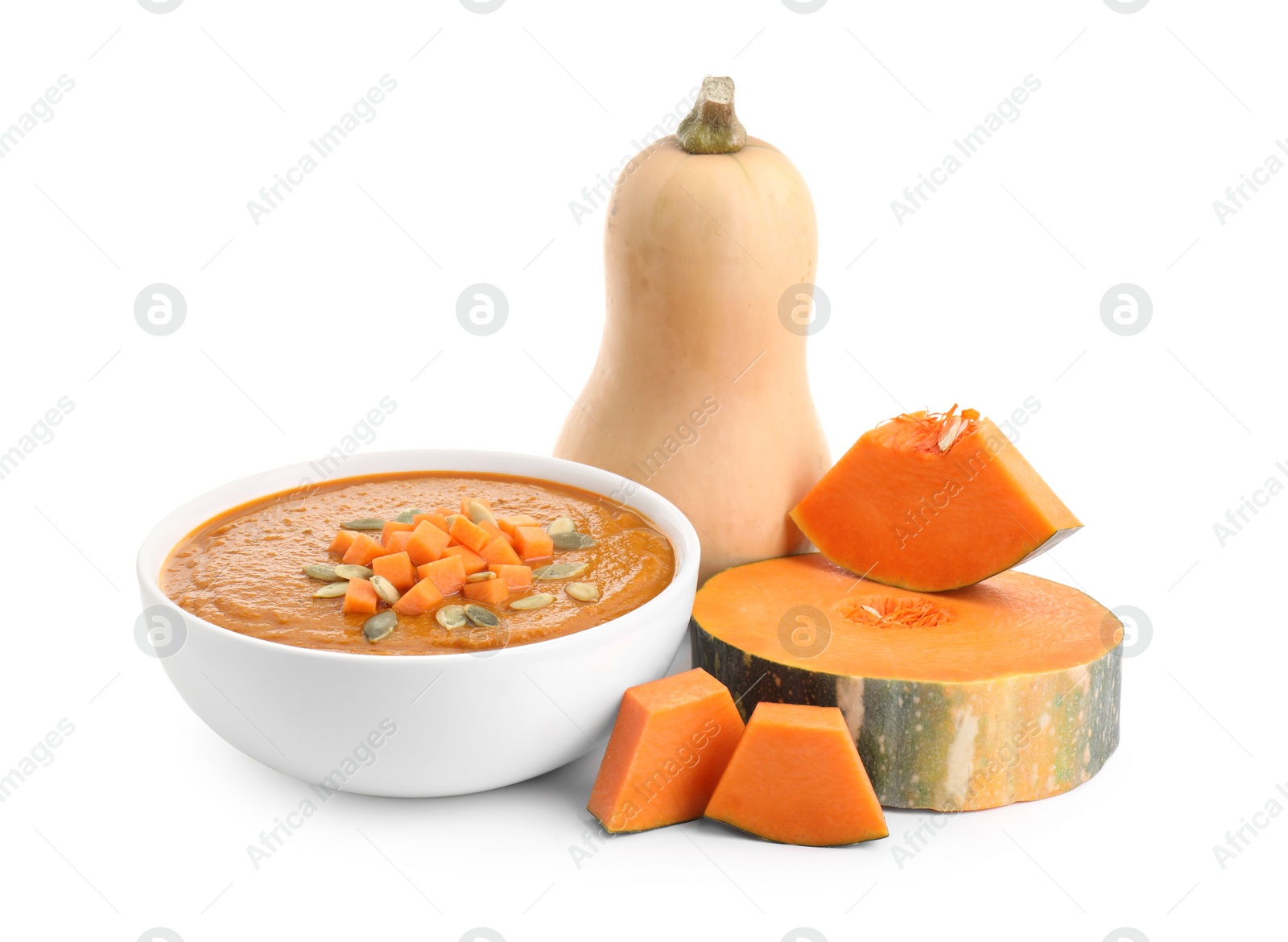 Photo of Delicious pumpkin cream soup with seeds in bowl and ingredients isolated on white