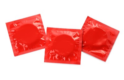 Condom packages isolated on white, top view. Safe sex