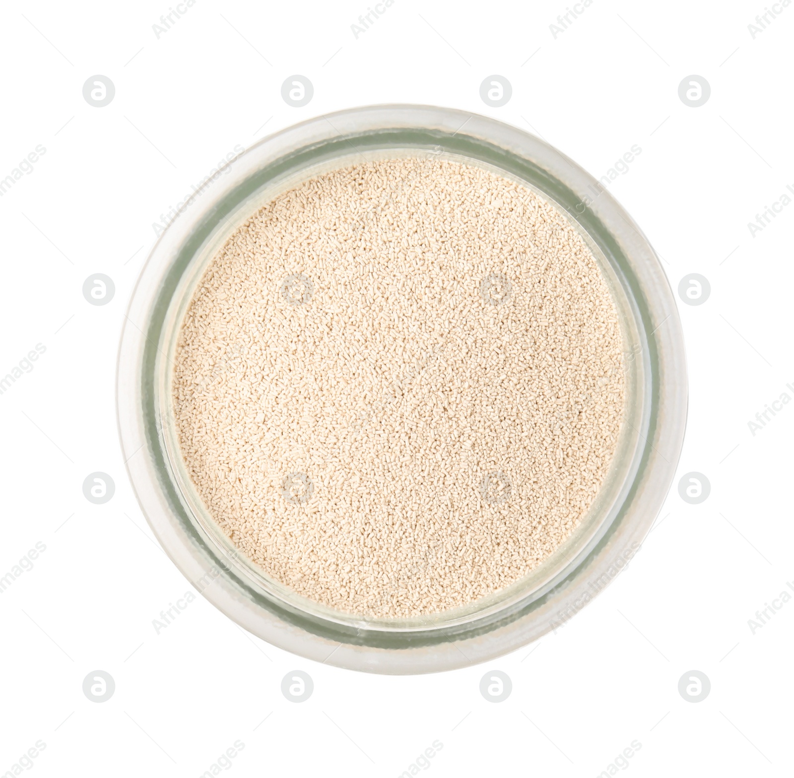 Photo of Granulated yeast in glass jar isolated on white, top view