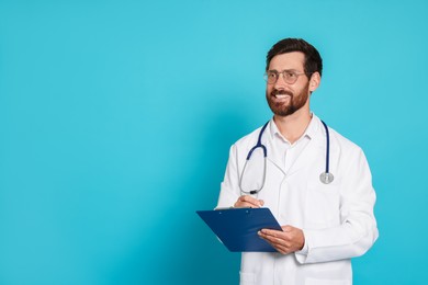 Doctor with stethoscope and clipboard on light blue background. Space for text