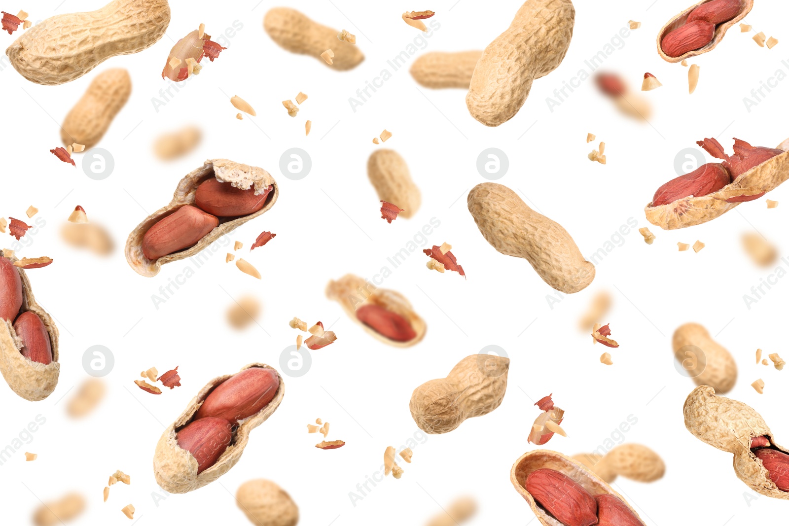 Image of Unpeeled peanuts in air on white background