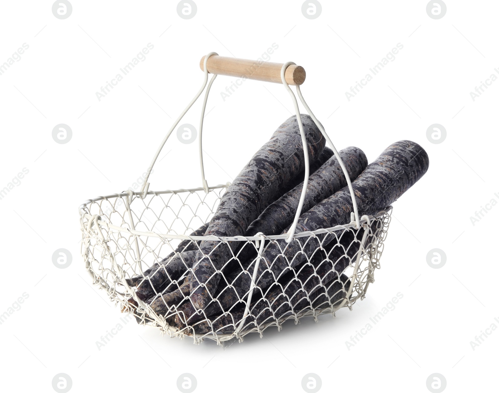 Photo of Raw black carrots in metal basket isolated on white